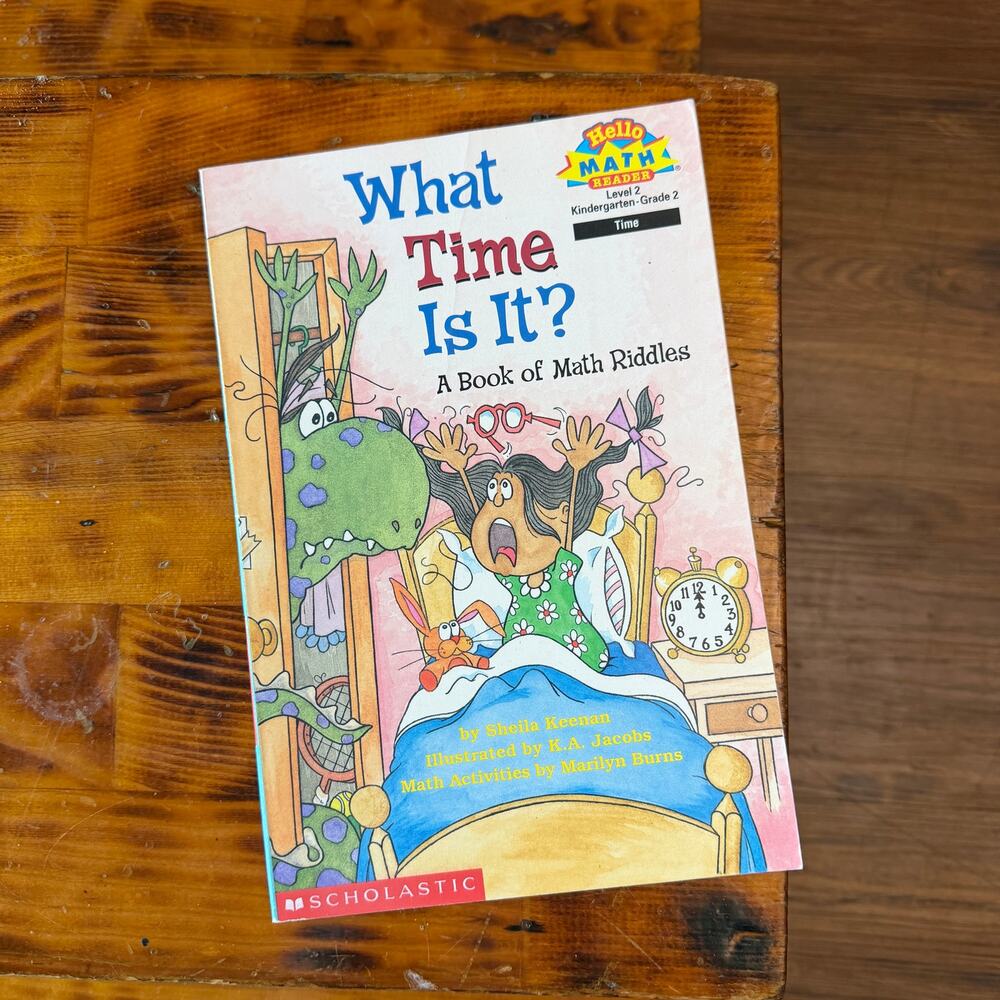 Vintage 1999 Scholastic What Time Is It? A Book Of Math Riddles Paperback Book